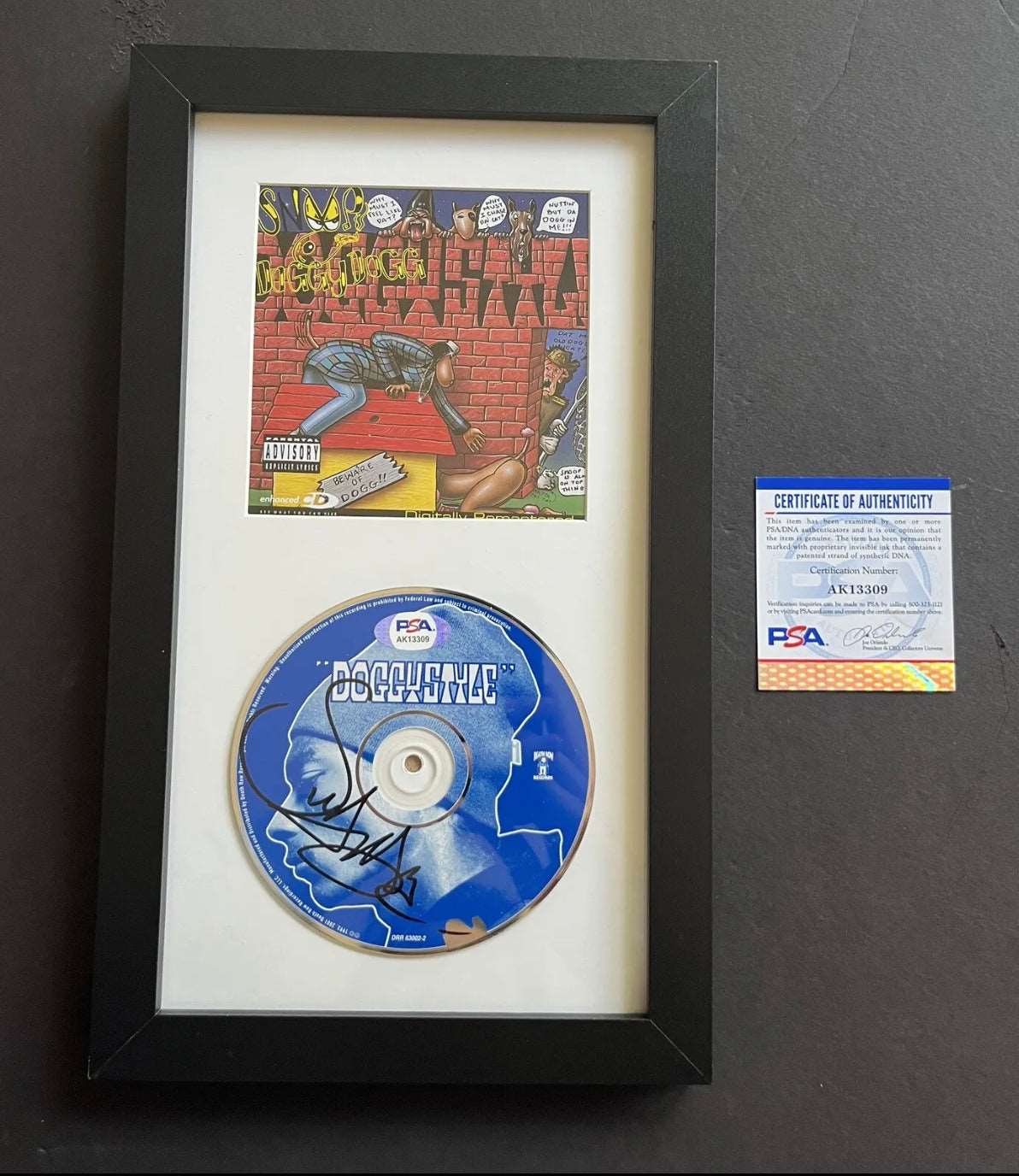 Autographed by Snoop Doggy dogg 🔥 Framed Signed 1993 Snoop Dogg Doggystyle CD Framed with Album Cover PSA Authenticated ✅ - DaFunkoShop - Framed CD